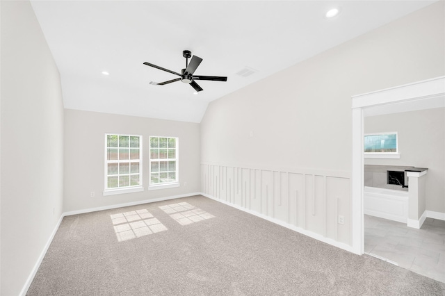 8714 Clarington St, Houston, TX 77016 - carpeted empty room with ceiling fan, lofted ceiling, recessed lighting, and baseboards