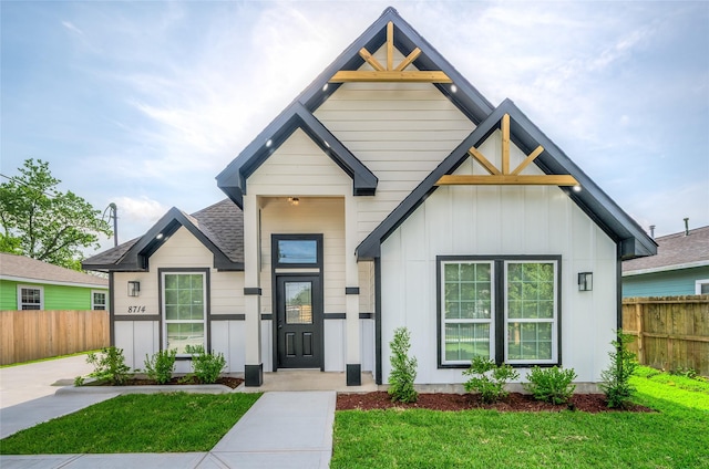 8714 Clarington St, Houston, TX 77016 - view of front of home featuring board and batten siding and a shingled roof