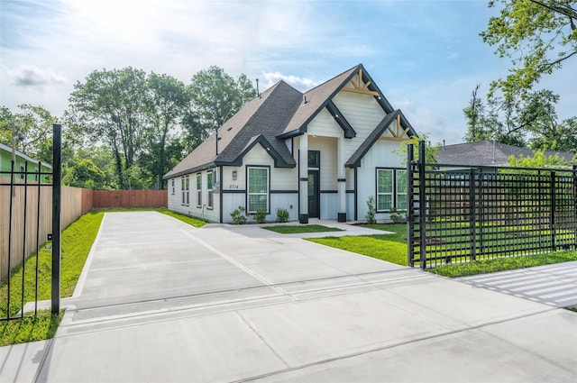 8714 Clarington St, Houston, TX 77016 - view of front of home featuring driveway and a shingled roof