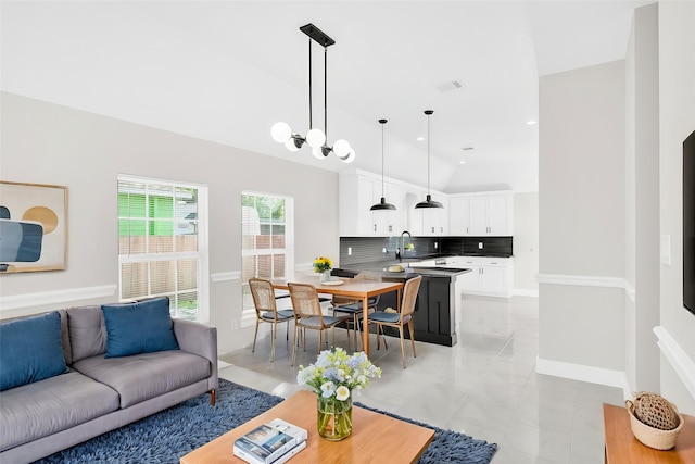 8714 Clarington St, Houston, TX 77016 - living area with light tile patterned flooring, vaulted ceiling, recessed lighting, and baseboards