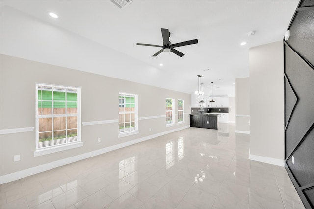 8714 Clarington St, Houston, TX 77016 - unfurnished living room with baseboards, a ceiling fan, vaulted ceiling, and recessed lighting