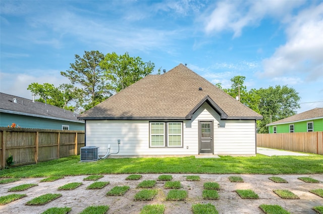 8714 Clarington St, Houston, TX 77016 - back of property featuring central air condition unit and a shingled roof