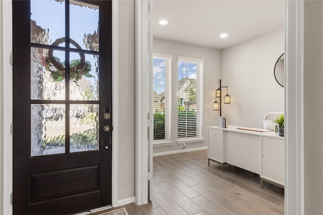 16334 Silver Emperor St, Humble, TX 77346 - foyer with wood finished floors, baseboards, and recessed lighting