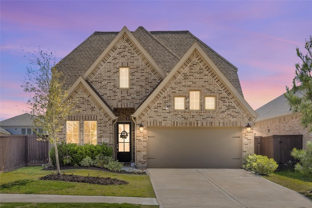 16334 Silver Emperor St, Humble, TX 77346 - view of front of home featuring brick siding, driveway, roof with shingles, and a garage