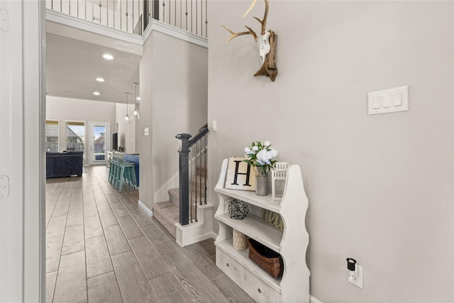 16334 Silver Emperor St, Humble, TX 77346 - hall featuring wood finished floors, stairs, baseboards, and recessed lighting