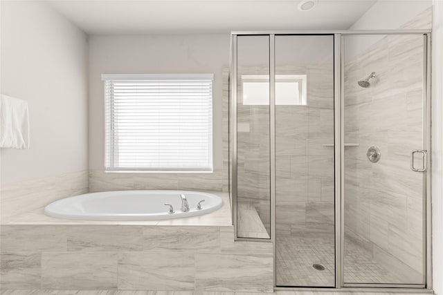 16334 Silver Emperor St, Humble, TX 77346 - bathroom featuring a bath and a stall shower