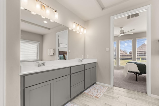 16334 Silver Emperor St, Humble, TX 77346 - bathroom with ensuite bathroom, a ceiling fan, double vanity, and baseboards