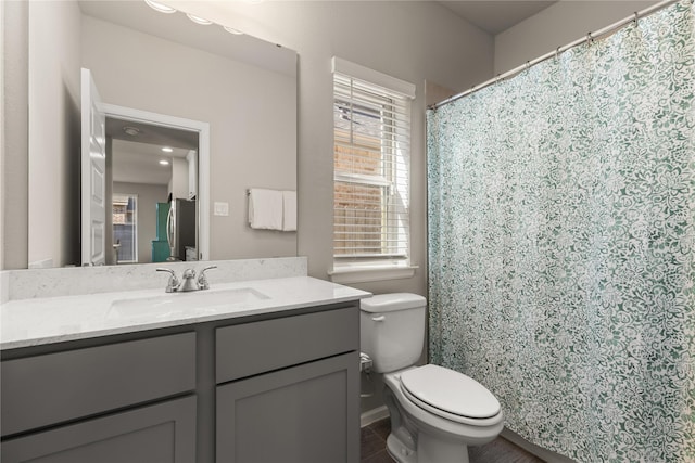 16334 Silver Emperor St, Humble, TX 77346 - bathroom with toilet, vanity, and plenty of natural light