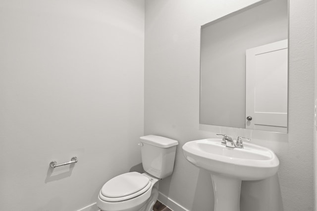 5810 Bright Keel Dr, Katy, TX 77493 - bathroom with baseboards, toilet, and a sink