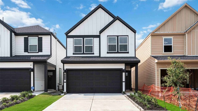 12316 Frisco Cove Ct, Houston, TX 77047 - view of front of property featuring board and batten siding, a garage, roof with shingles, and concrete driveway