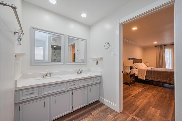 2906 Laurel Fork Dr, Houston, TX 77339 - ensuite bathroom with double vanity, wood finished floors, baseboards, a shower, and recessed lighting