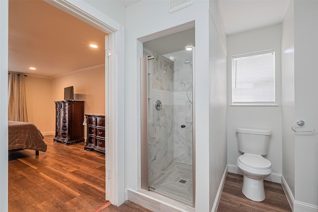 2906 Laurel Fork Dr, Houston, TX 77339 - full bathroom with wood finished floors, a marble finish shower, toilet, recessed lighting, and baseboards