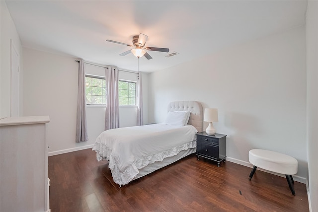 2906 Laurel Fork Dr, Houston, TX 77339 - bedroom featuring dark wood-style floors, a ceiling fan, and baseboards