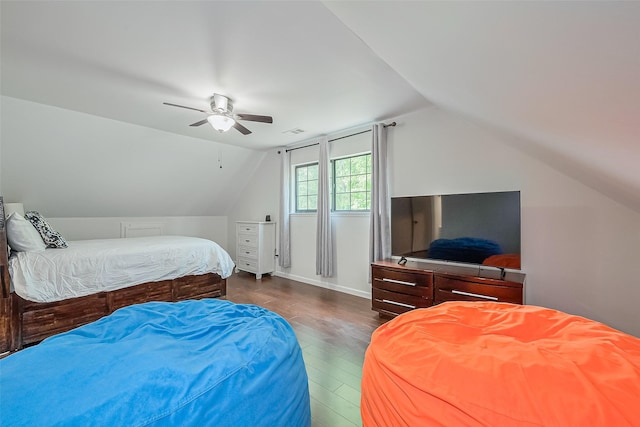 2906 Laurel Fork Dr, Houston, TX 77339 - bedroom featuring lofted ceiling, wood finished floors, a ceiling fan, and baseboards