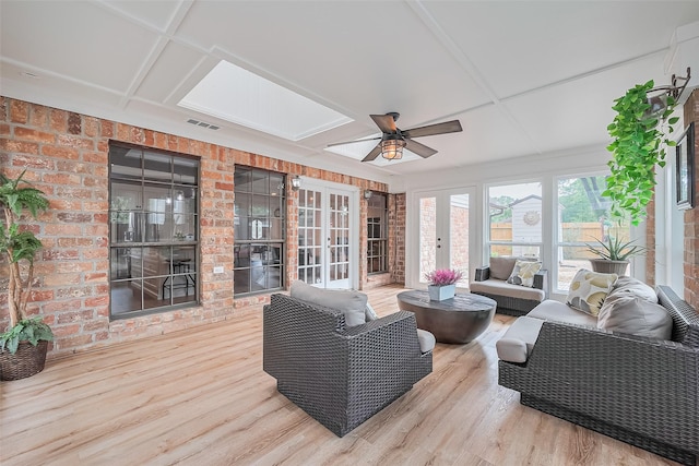 2906 Laurel Fork Dr, Houston, TX 77339 - sunroom / solarium with french doors, a deck, wood finished floors, a skylight, and brick wall
