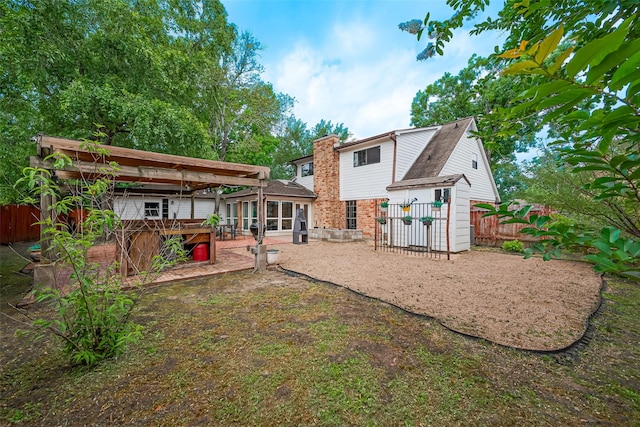 2906 Laurel Fork Dr, Houston, TX 77339 - rear view of property with a patio area and a sunroom