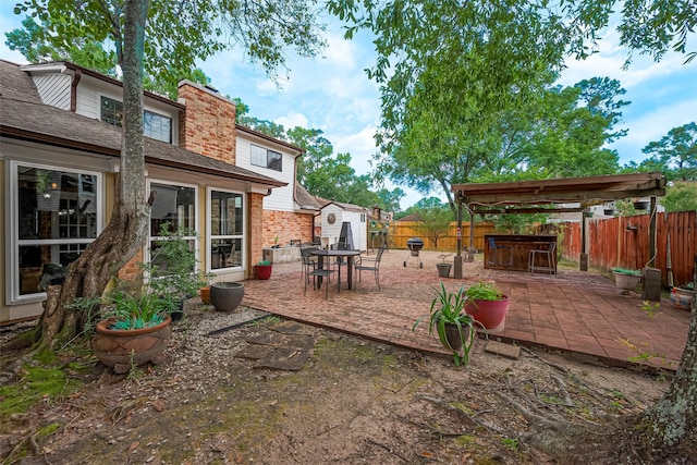 2906 Laurel Fork Dr, Houston, TX 77339 - fenced backyard with a patio area and outdoor dining area