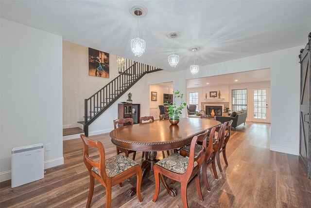2906 Laurel Fork Dr, Houston, TX 77339 - dining space featuring stairs, wood finished floors, and baseboards