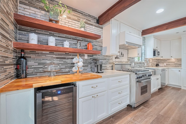 2906 Laurel Fork Dr, Houston, TX 77339 - kitchen with wine cooler, stainless steel appliances, decorative backsplash, beamed ceiling, and exhaust hood