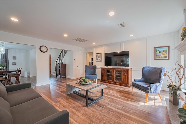 2906 Laurel Fork Dr, Houston, TX 77339 - living room with light wood finished floors, stairs, recessed lighting, and baseboards