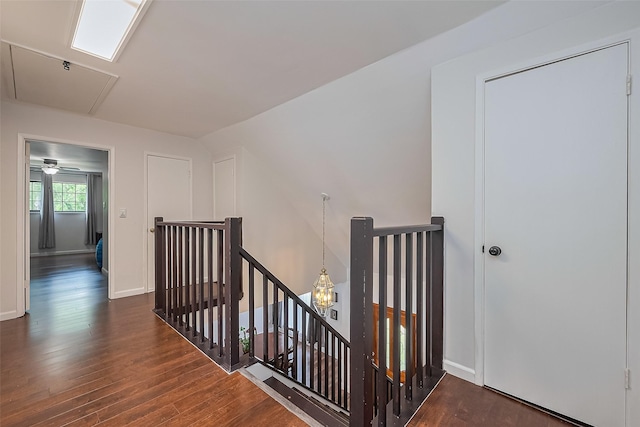 2906 Laurel Fork Dr, Houston, TX 77339 - stairs featuring attic access, wood finished floors, and baseboards