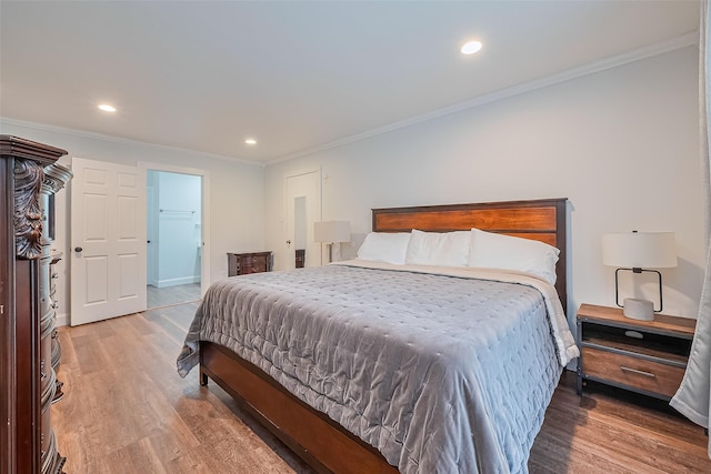 2906 Laurel Fork Dr, Houston, TX 77339 - bedroom with light wood-type flooring, crown molding, recessed lighting, and baseboards