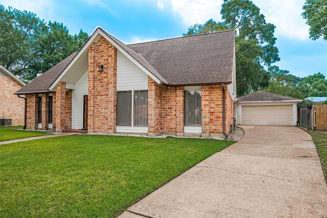 2906 Laurel Fork Dr, Houston, TX 77339 - view of front of house featuring a shingled roof, brick siding, a detached garage, and central AC unit