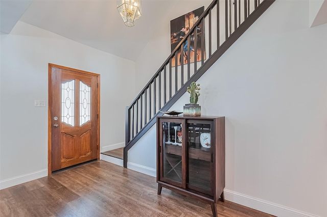 2906 Laurel Fork Dr, Houston, TX 77339 - entryway featuring stairs, baseboards, wood finished floors, and a chandelier