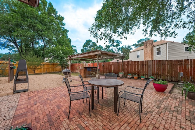2906 Laurel Fork Dr, Houston, TX 77339 - fenced backyard with a patio area, a pergola, and outdoor dining area