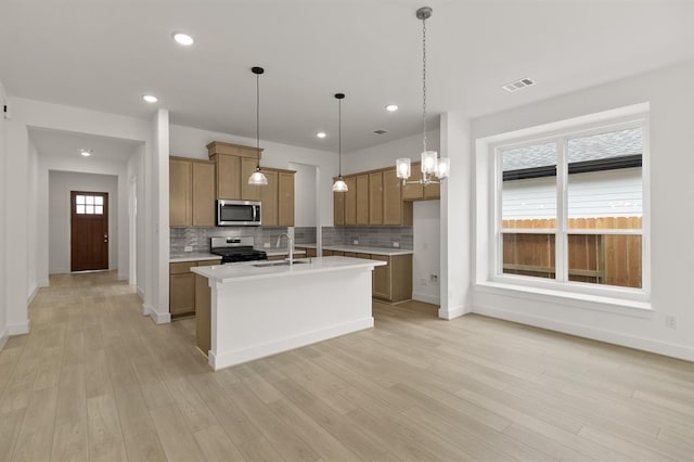 8335 Red Shiner Way, Fulshear, TX 77441 - kitchen featuring stainless steel appliances, a sink, decorative backsplash, light countertops, and recessed lighting
