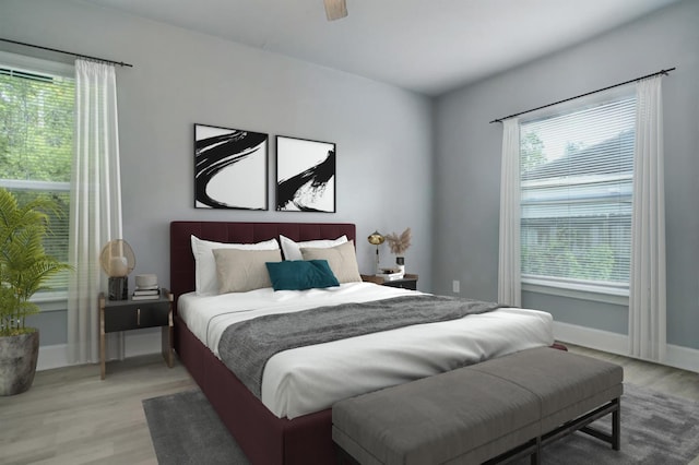 4523 Keystone St, Houston, TX 77021 - bedroom with light wood-type flooring, baseboards, and a ceiling fan