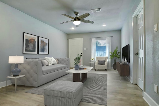 4523 Keystone St, Houston, TX 77021 - living area with light wood finished floors, ceiling fan, baseboards, and recessed lighting