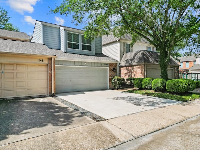 1146 Fountain View Dr Unit 204, Houston, TX 77057 - multi unit property with brick siding, driveway, and roof with shingles
