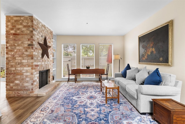 1146 Fountain View Dr Unit 204, Houston, TX 77057 - living room featuring wood finished floors and a brick fireplace