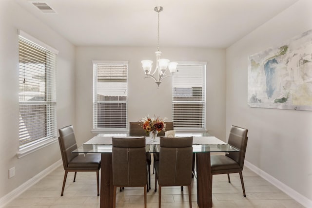 5010 Trembling Aspen Ln, Rosenberg, TX 77471 - dining space featuring a chandelier, plenty of natural light, baseboards, and light tile patterned floors