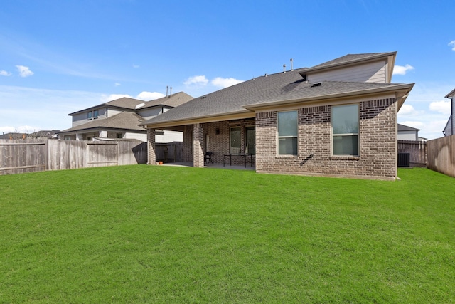 5010 Trembling Aspen Ln, Rosenberg, TX 77471 - back of house with brick siding, a patio, a shingled roof, and central air condition unit