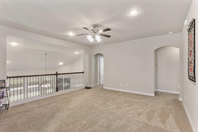 5010 Trembling Aspen Ln, Rosenberg, TX 77471 - empty room featuring arched walkways, a ceiling fan, carpet flooring, recessed lighting, and baseboards