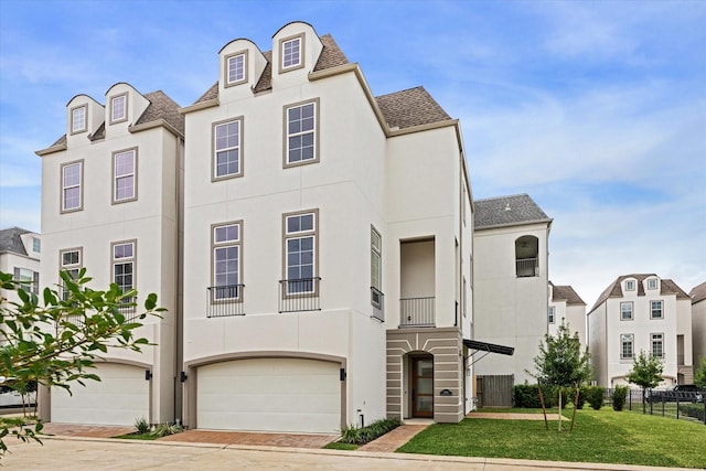 11118 Savannah Woods Ln, Houston, TX 77043 - view of front of home featuring stucco siding, a shingled roof, an attached garage, and driveway