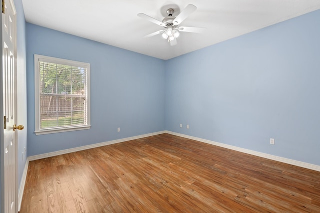 2100 Williams Glen Dr, Bryan, TX 77808 - unfurnished room featuring baseboards, a ceiling fan, and wood finished floors