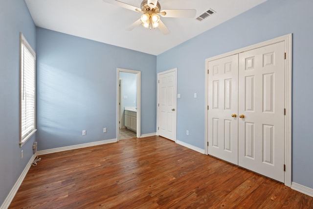 2100 Williams Glen Dr, Bryan, TX 77808 - unfurnished bedroom featuring wood finished floors, baseboards, and a closet