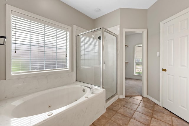 2100 Williams Glen Dr, Bryan, TX 77808 - full bath featuring plenty of natural light, a shower stall, a whirlpool tub, and tile patterned flooring