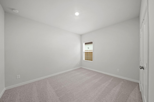 18523 Lilliput Ln, New Caney, TX 77357 - empty room with light colored carpet, baseboards, a smoke detector, and recessed lighting