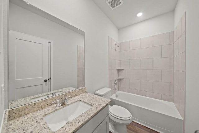 18523 Lilliput Ln, New Caney, TX 77357 - bathroom with toilet, wood finished floors, shower / bathtub combination, vanity, and recessed lighting