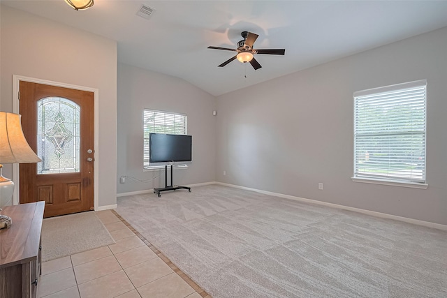 614 Starboard Ct, Katy, TX 77494 - foyer with light colored carpet, a ceiling fan, baseboards, light tile patterned flooring, and lofted ceiling