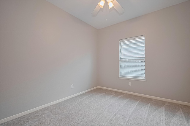 614 Starboard Ct, Katy, TX 77494 - empty room featuring baseboards, light carpet, a ceiling fan, and vaulted ceiling
