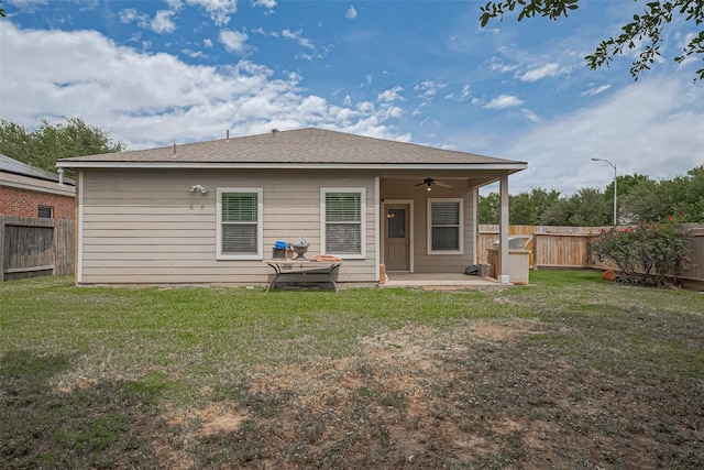 614 Starboard Ct, Katy, TX 77494 - rear view of property featuring a ceiling fan, a patio area, and roof with shingles