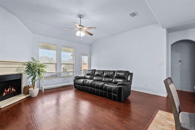 9108 Yellow Cedar Trl, Fort Worth, TX 76244 - living area with a high end fireplace, a ceiling fan, wood finished floors, arched walkways, and vaulted ceiling
