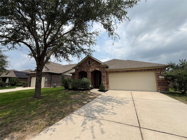 20214 Blue Lake View Ln, Humble, TX 77338 - view of front of house featuring a garage, driveway, a front yard, brick siding, and roof with shingles