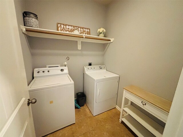 20214 Blue Lake View Ln, Humble, TX 77338 - laundry room featuring independent washer and dryer and light tile patterned floors