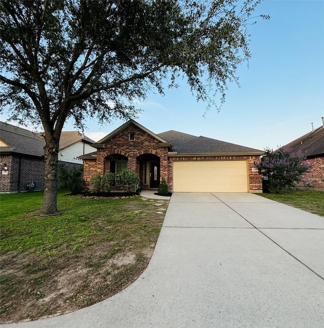 20214 Blue Lake View Ln, Humble, TX 77338 - view of front of home with a garage, driveway, a front yard, brick siding, and roof with shingles
